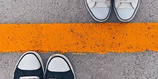 yellow line in the middle a pair of shoes on either side